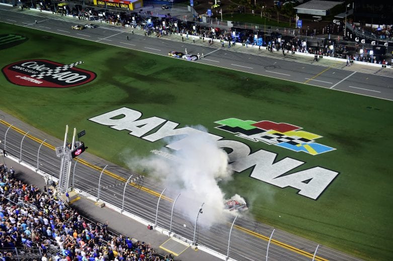 DAYTONA BEACH, FL - JULY 07: Erik Jones, driver of the #20 buyatoyota.com Toyota, celebrates with a burnout after winning the Monster Energy NASCAR Cup Series Coke Zero Sugar 400 at Daytona International Speedway on July 7, 2018 in Daytona Beach, Florida. (Photo by Jared C. Tilton/Getty Images) | Getty Images
