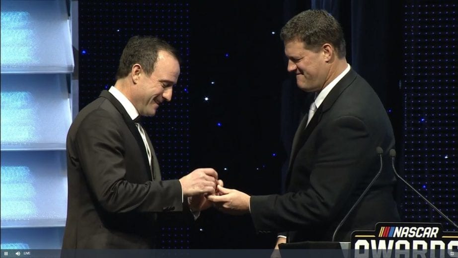LP Dumoulin receives his championship ring from Steve O'Donnell at the NASCAR Awards in Charlotte.