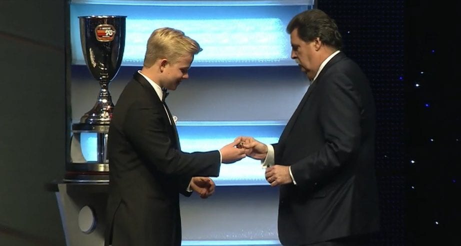 Tyler Ankrum receives his championship ring from Mike Helton at the NASCAR Awards.