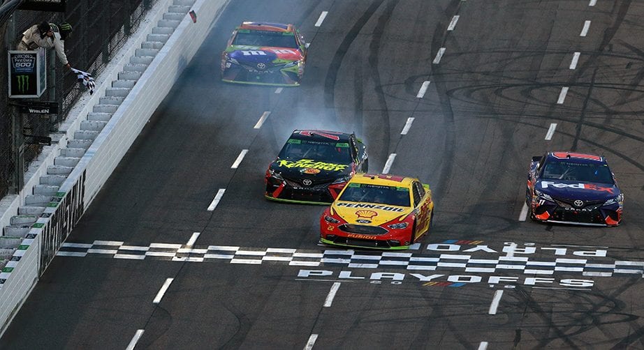 Joey Logano, Martin Truex Jr., Denny Hamlin and Kyle Busch race to the finish line at Martinsville.