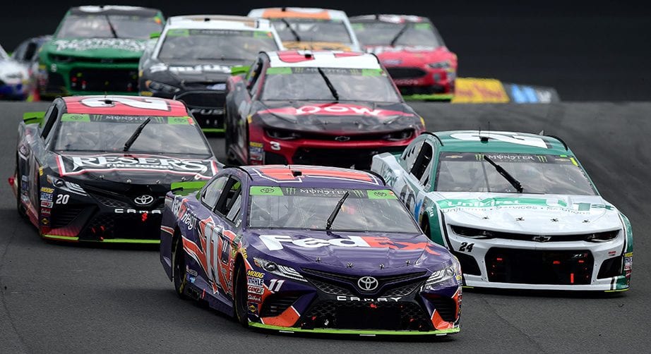 Denny Hamlin leads a pack of cars at the Charlotte Road Course.
