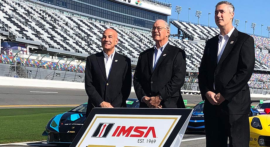From left, IMSA President Scott Atherton, IMSA Chairman, Jim France and IMSA CEO Ed Bennett on pit road at Daytona International Speedway.