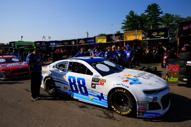 WATKINS GLEN, NY - AUGUST 05:  Crew members push the #88 Nationwide Children's Hospital Chevrolet, driven by Alex Bowman(not pictured), through the garage area during the Monster Energy NASCAR Cup Series GoBowling at The Glen at Watkins Glen International on August 5, 2018 in Watkins Glen, New York.  (Photo by Chris Trotman/Getty Images) | Getty Images
