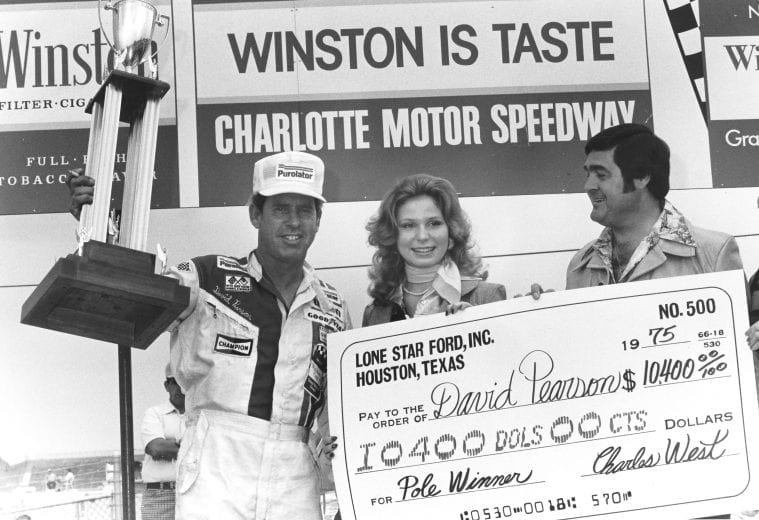 David Pearson accepts a trophy for winning the pole at Charlotte Motor Speedway.