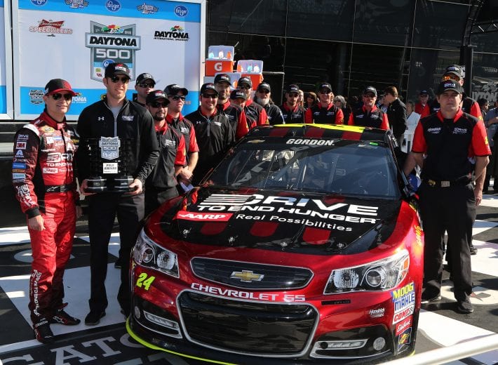 Jeff Gordon and the No. 24 team pose for a photo after winning the pole for the 2015 Daytona 500.