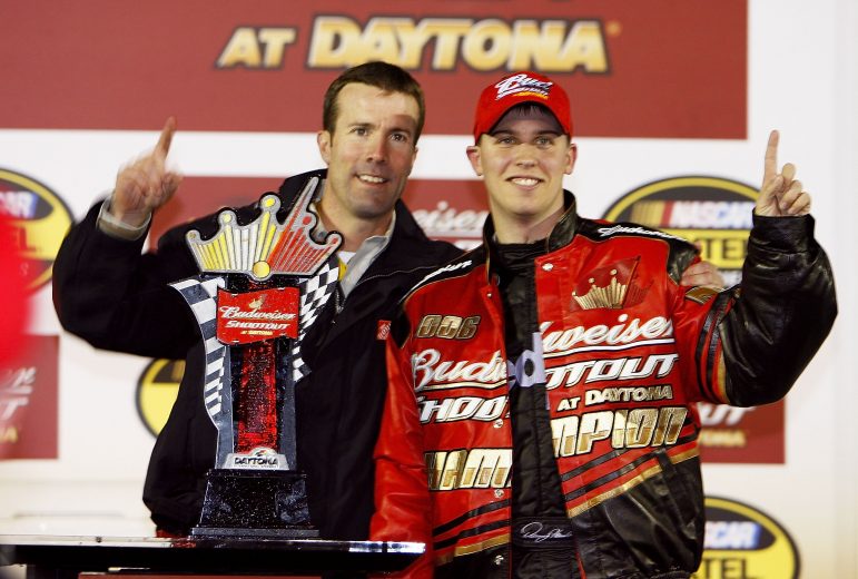 DAYTONA BEACH , FL - FEBRUARY 12: Denny Hamlin, driver of the #11 FedEx Express Chevrolet and team President J.D. Gibbs of Joe Gibbs Racing celebrate in victory lane after winning the NASCAR Nextel Cup Budweiser Shootout on February 12, 2006 at Daytona International Speedway in Daytona Beach, Florida. (Photo by Rusty Jarrett/Getty Images) | Getty Images