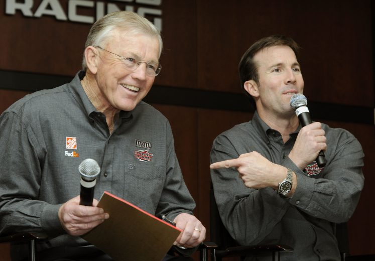 HUNTERSVILLE, NC - JANUARY 22: J.D. Gibbs (R) teases his father, Joe Gibbs during an event at Joe Gibbs Racing January 22, 2007 in Huntersville, North Carolina. (Photo by Grant Halverson/Getty Images) | Getty Images