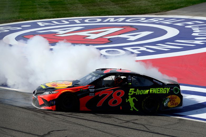 FONTANA, CA - MARCH 18:  Martin Truex Jr., driver of the #78 Bass Pro Shops/5-hour ENERGY Toyota, celebrates with a burnout after winning the Monster Energy NASCAR Cup Series Auto Club 400 at Auto Club Speedway on March 18, 2018 in Fontana, California.  (Photo by Robert Laberge/Getty Images) | Getty Images