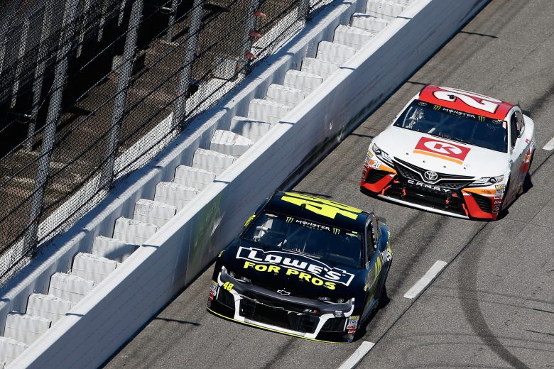 MARTINSVILLE, VA - MARCH 26:  Jimmie Johnson, driver of the #48 Lowe's for Pros Chevrolet, leads Erik Jones, driver of the #20 Circle K Toyota, during the weather delayed Monster Energy NASCAR Cup Series STP 500 at Martinsville Speedway on March 26, 2018 in Martinsville, Virginia.  (Photo by Brian Lawdermilk/Getty Images) | Getty Images