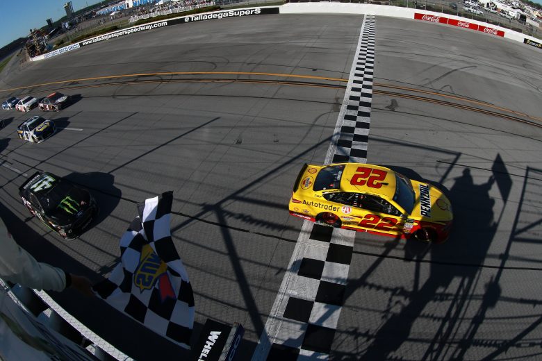 TALLADEGA, AL - APRIL 29:  Joey Logano, driver of the #22 Shell Pennzoil/Autotrader Ford, takes the checkere flag to win the Monster Energy NASCAR Cup Series GEICO 500 at Talladega Superspeedway on April 29, 2018 in Talladega, Alabama.  (Photo by Sean Gardner/Getty Images) | Getty Images