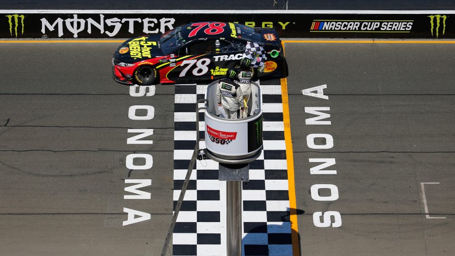 SONOMA, CA - JUNE 24:  Martin Truex Jr., driver of the #78 5-hour ENERGY/Bass Pro Shops Toyota, crosses the finish line to win the Monster Energy NASCAR Cup Series Toyota/Save Mart 350 at Sonoma Raceway on June 24, 2018 in Sonoma, California.  (Photo by Jonathan Ferrey/Getty Images) | Getty Images