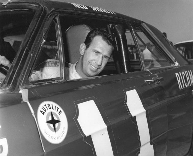 Ned Jarrett poses for a photo inside his No. 11 car in 1965.