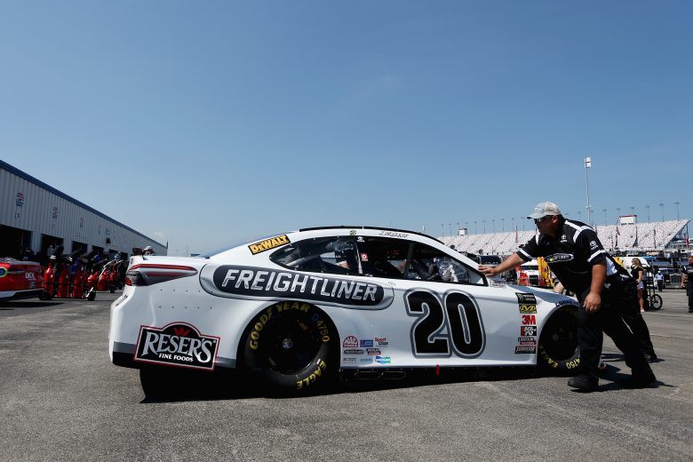 SPARTA, KY - JULY 13: Crew members push the car of Erik Jones, driver of the #20 Freightliner Toyota, through the garage area during practice for the Monster Energy NASCAR Cup Series Quaker State 400 presented by Walmart at Kentucky Speedway on July 13, 2018 in Sparta, Kentucky.  (Photo by Brian Lawdermilk/Getty Images) | Getty Images