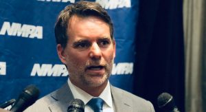 Jeff Gordon speaks to a group of reporters at the NMPA Hall of Fame induction ceremony.