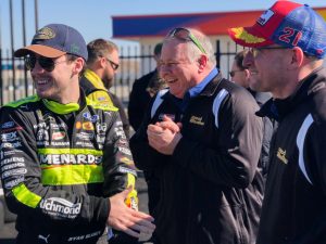 Ryan Blaney hangs with some of the Wood Brothers Racing crew at Charlotte Motor Speedway.