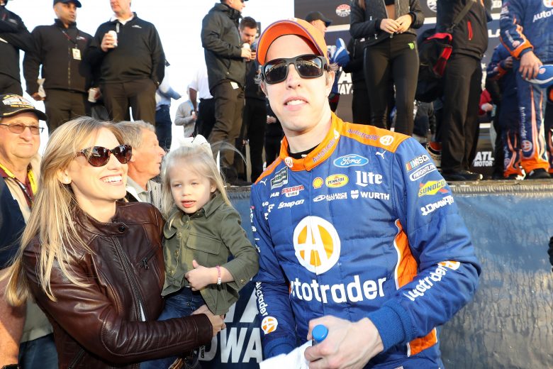 HAMPTON, GA - FEBRUARY 24: Brad Keselowski, driver of the #2 Autotrader Ford, celebrates after winning by placing the Winner's Sticker on his car with his wife Paige and their daughter Scarlett during the Monster Energy NASCAR Cup Series Folds of Honor QuikTrip 500 at Atlanta Motor Speedway on February 24, 2019 in Hampton, Georgia. (Photo by Chris Graythen/Getty Images) | Getty Images