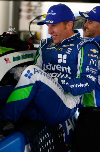 Jamie McMurray climbs in his car at Daytona.