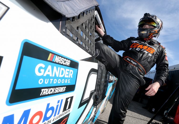 DAYTONA BEACH, FL - FEBRUARY 14: Brett Moffitt, driver of the #24 Plan B Sales Chevrolet, gets into his truck during practice for the NASCAR Gander Outdoor Truck Series NextEra Energy 250 at Daytona International Speedway on February 14, 2019 in Daytona Beach, Florida. (Photo by Brian Lawdermilk/Getty Images) | Getty Images