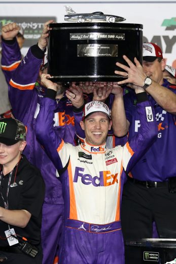 DAYTONA BEACH, FL - FEBRUARY 17: Denny Hamlin, driver of the #11 FedEx Express Toyota, celebrates in victory lane after winning the Monster Energy NASCAR Cup Series 61st Annual Daytona 500 at Daytona International Speedway on February 17, 2019 in Daytona Beach, Florida. (Photo by Chris Graythen/Getty Images) | Getty Images