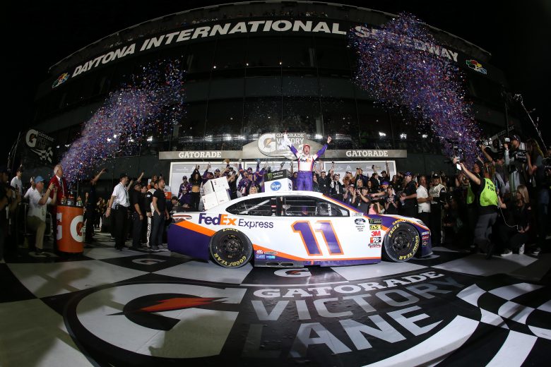 DAYTONA BEACH, FL - FEBRUARY 17: Denny Hamlin, driver of the #11 FedEx Express Toyota, celebrates in victory lane after winning the Monster Energy NASCAR Cup Series 61st Annual Daytona 500 at Daytona International Speedway on February 17, 2019 in Daytona Beach, Florida. (Photo by Chris Graythen/Getty Images) | Getty Images