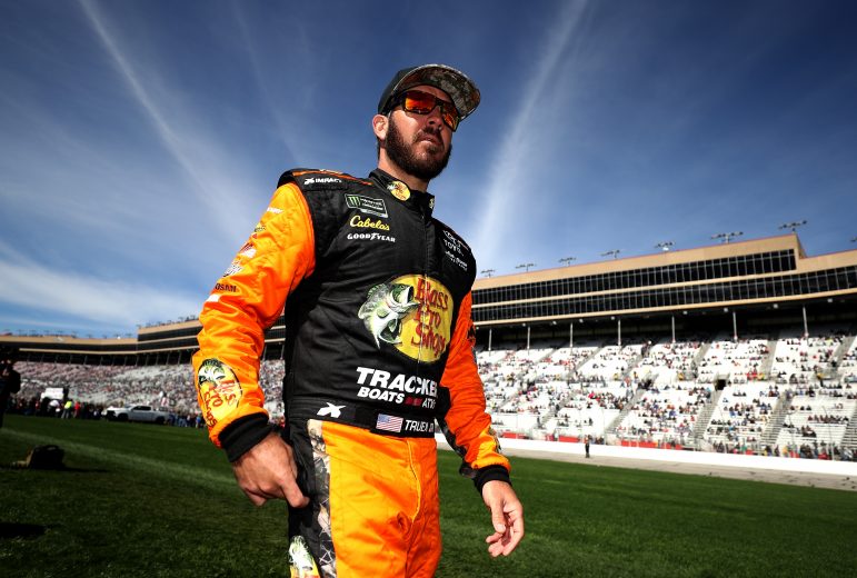 HAMPTON, GA - FEBRUARY 24:  Martin Truex Jr., driver of the #19 Bass Pro Shops Toyota, stands on the grid during the Monster Energy NASCAR Cup Series Folds of Honor QuikTrip 500 at Atlanta Motor Speedway on February 24, 2019 in Hampton, Georgia.  (Photo by Chris Graythen/Getty Images) | Getty Images