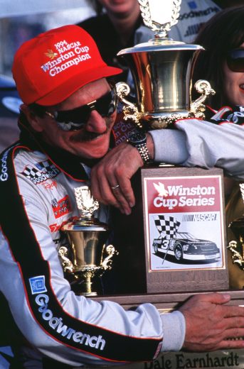 ROCKINGHAM, NC - OCTOBER 23: Dale Earnhardt driver of the #3 GM Goodwrench Cheverolet poses with the NASCAR Winston Cup championship trophy after winning the AC Delco 500 on October 23, 1994 at the North Carolina Motor Speedway in Rockingham, North Carolina. (Photo by Bill Hall/Getty Images)