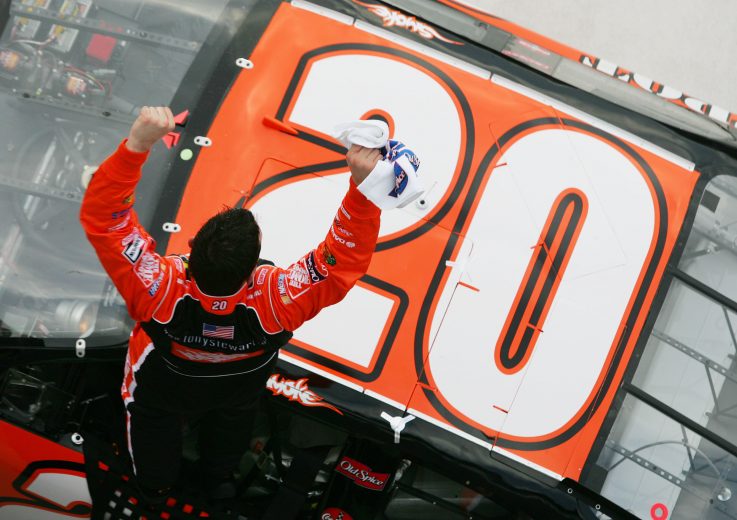 DAYTONA BEACH, FL - FEBRUARY 17: Tony Stewart climbs onto the #20 Home Depot Chevrolet after winning the second Gatorade Duel race at the NASCAR Nextel Cup Daytona 500 on February 17, 2005 at the Daytona International Speedway in Daytona, Florida. (Photo By Jamie Squire/Getty Images) | Getty Images