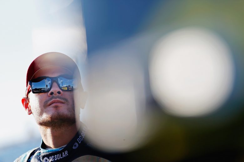 HOMESTEAD, FL - NOVEMBER 18: Kyle Larson, driver of the #24 DC Solar Chevrolet, stands on the grid during qualifying for the NASCAR Camping World Truck Series Ford EcoBoost 200 at Homestead-Miami Speedway on November 18, 2016 in Homestead, Florida. (Photo by Brian Lawdermilk/Getty Images) | Getty Images