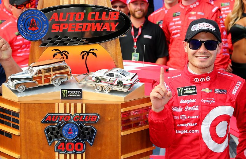 FONTANA, CA - MARCH 26: Kyle Larson, driver of the #42 Target Chevrolet, poses with the trophy in victory lane after winning the Monster Energy NASCAR Cup Series Auto Club 400 at Auto Club Speedway on March 26, 2017 in Fontana, California. (Photo by Sarah Crabill/Getty Images) | Getty Images