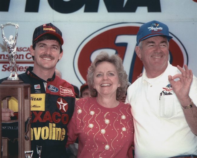 DAYTONA BEACH, FL - FEBRUARY 16: Davey Allison (Feb 25, 1961-July 13, 1993) driver of the Robert Yates Racing #28 Texaco-Havoline Ford celebrates with his dad Bobby and mom Judy after winning the 1992 NASCAR Winston Cup Daytona 500 at the Daytona International Speedway on February 16, 1992 in Daytona Beach, Florida. (Photo by ISC Archives via Getty Images)