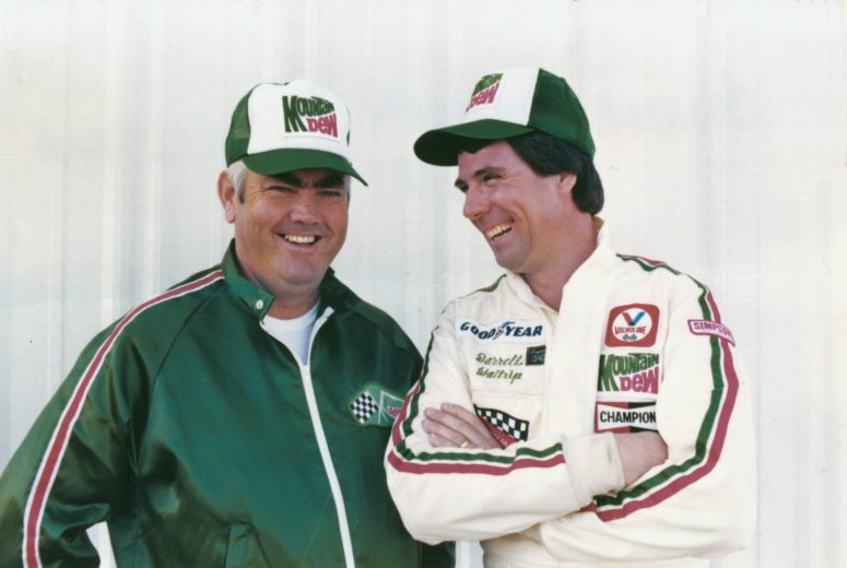 1982: After winning his first NASCAR Cup title in 1981, his first year with the Junior Johnson Mountain Dew team, Waltrip repeated with a late season rally to gain the title again. (L-R: Junior Johnson; Darrell Waltrip) (Photo by ISC Archives via Getty Images)