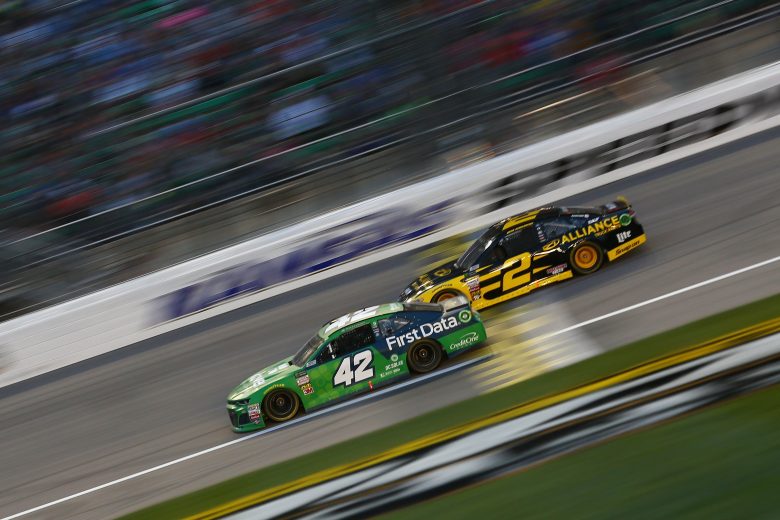 KANSAS CITY, KS - MAY 12: Kyle Larson, driver of the #42 Clover/First Data Chevrolet, leads Brad Keselowski, driver of the #2 Alliance Truck Parts Ford, during the Monster Energy NASCAR Cup Series KC Masterpiece 400 at Kansas Speedway on May 12, 2018 in Kansas City, Kansas. (Photo by Sarah Crabill/Getty Images) | Getty Images