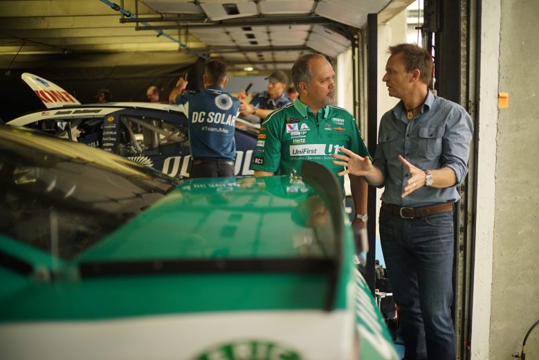 Concord, NC - Host Phil Keoghan (R) with Hendrick Team crew chief Darian Grubb. (National Geographic/Alex Mandiola)