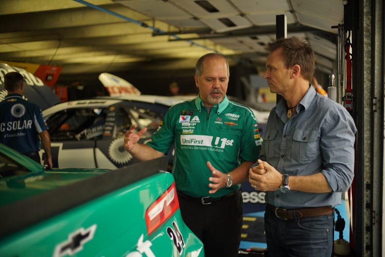 Concord, NC - Host Phil Keoghan (R) with Hendrick Team crew chief Darian Grubb. (National Geographic/Alex Mandiola)