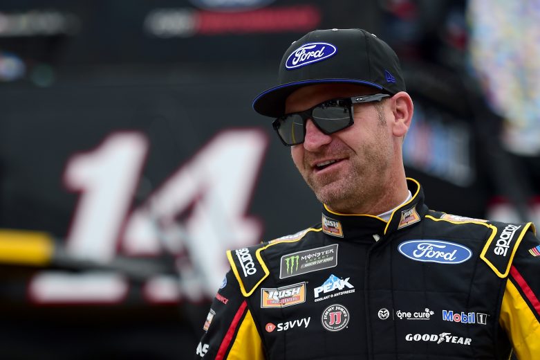 Clint Bowyer shares a smile in the garage at Daytona.