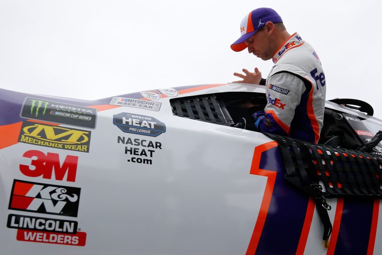 Denny Hamlin climbs into the No. 11 Joe Gibbs Racing Toyota.