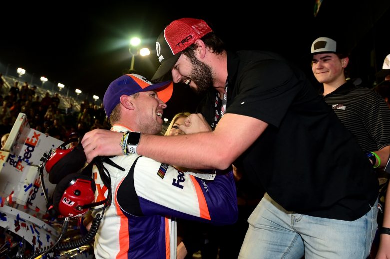 Denny Hamlin celebrates his 2019 Daytona 500 victory with Jackson Gibbs, the son of the late J.D. Gibbs.
