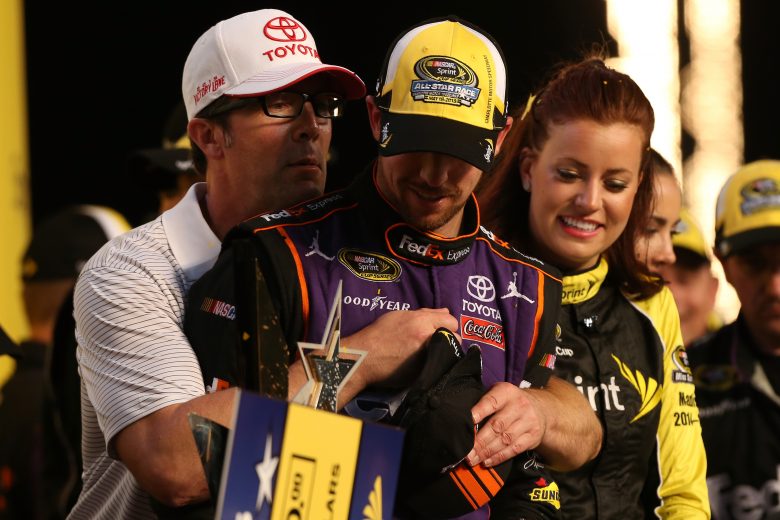 Denny Hamlin, driver of the #11 FedEx Express Toyota, celebrates with a team owner, J.D. Gibbs, after winning the NASCAR Sprint Cup Series Sprint All-Star Race at Charlotte Motor Speedway on May 16, 2015 in Charlotte, North Carolina. (Photo by Nick Laham/NASCAR via Getty Images)