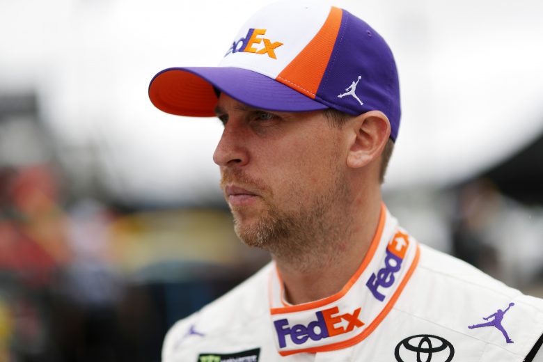Denny Hamlin looks on in the garage at Daytona.