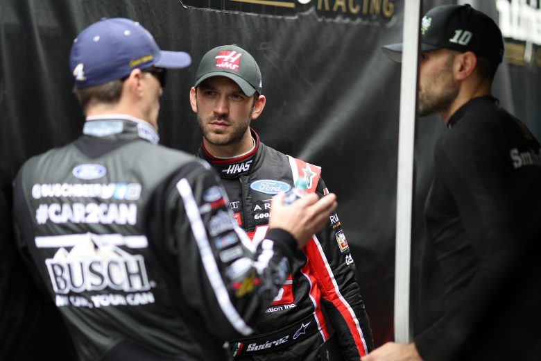 Kevin Harvick, Daniel Suarez and Aric Almirola chat in the garage at Daytona.