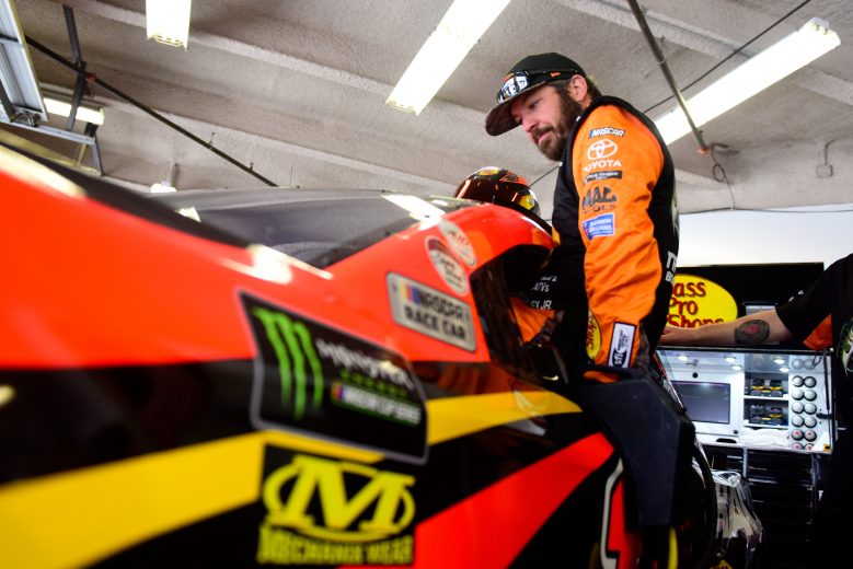 Martin Truex Jr. climbs into the No. 19 Joe Gibbs Racing Toyota.