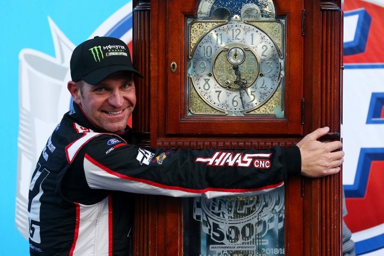 MARTINSVILLE, VA - MARCH 26:  Clint Bowyer, driver of the #14 Haas Automation Demo Day Ford, celebrates with the trophy in Victory Lane after winning the weather delayed Monster Energy NASCAR Cup Series STP 500 at Martinsville Speedway on March 26, 2018 in Martinsville, Virginia.  (Photo by Sarah Crabill/Getty Images) | Getty Images