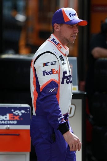 HAMPTON, GA - FEBRUARY 22: Denny Hamlin, driver of the #11 FedEx Ground Toyota, stands on the grid during practice for the Monster Energy NASCAR Cup Series Folds of Honor Quiktrip 500 at Atlanta Motor Speedway on February 22, 2019 in Hampton, Georgia. (Photo by Sean Gardner/Getty Images) | Getty Images