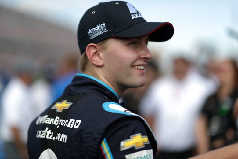 DAYTONA BEACH, FL - FEBRUARY 17: William Byron, driver of the #24 Axalta Chevrolet, stands on the grid prior to the start of the Monster Energy NASCAR Cup Series 61st Annual Daytona 500 at Daytona International Speedway on February 17, 2019 in Daytona Beach, Florida. (Photo by Chris Graythen/Getty Images) | Getty Images