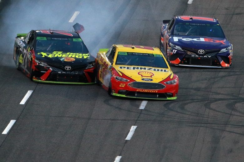MARTINSVILLE, VA - OCTOBER 28: Joey Logano, driver of the #22 Shell Pennzoil Ford, and Martin Truex Jr., driver of the #78 5-hour ENERGY/Bass Pro Shops Toyota, make contact ahead of Denny Hamlin, driver of the #11 FedEx Freight Toyota, as they race to the finish line during the Monster Energy NASCAR Cup Series First Data 500 at Martinsville Speedway on October 28, 2018 in Martinsville, Virginia. (Photo by Sean Gardner/Getty Images) | Getty Images