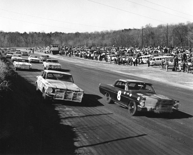 HILLSBORO, NC - MARCH 10, 1963:  Joe Weatherly (No. 8) has the Bud Moore Pontiac on the pole, and Jim Paschal flanks him on the outside of row one in the Petty Enterprises No. 41 for the start of a NASCAR Cup race at Orange Speedway. Richard Petty (No. 43) starts third, and eventual race winner Junior Johnson (No. 3), starts fourth. (Photo by ISC Images & Archives via Getty Images)
