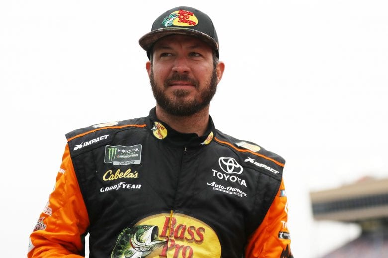 HAMPTON, GA - FEBRUARY 22:  Martin Truex Jr., driver of the #19 Bass Pro Shops Toyota, stands on the grid during qualifying for the Monster Energy NASCAR Cup Series Folds of Honor Quiktrip 500 at Atlanta Motor Speedway on February 22, 2019 in Hampton, Georgia.  (Photo by Chris Graythen/Getty Images) | Getty Images