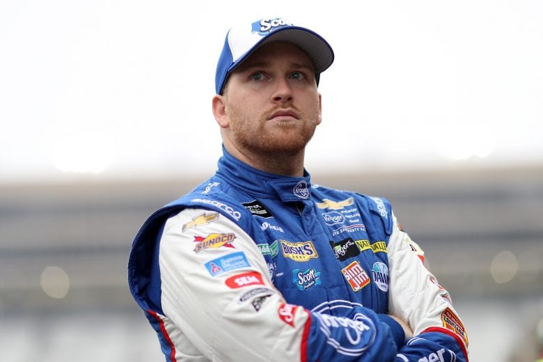 HAMPTON, GA - FEBRUARY 23:  Chris Buescher, driver of the #37 Scott Comfort Plus Chevrolet, stands in the garage area  during practice for the Monster Energy NASCAR Cup Series Folds of Honor Quiktrip 500 at Atlanta Motor Speedway on February 23, 2019 in Hampton, Georgia.  (Photo by Chris Graythen/Getty Images) | Getty Images