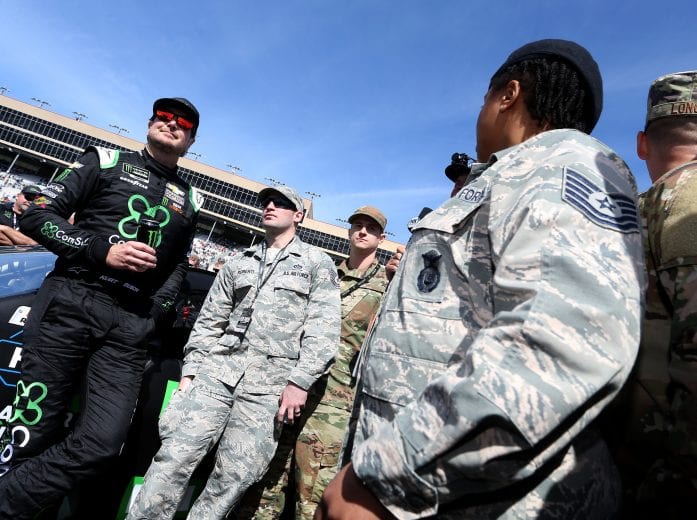 HAMPTON, GA - FEBRUARY 24:  Kurt Busch, driver of the #1 ComSurv Chevrolet, stands on the grid before the Monster Energy NASCAR Cup Series Folds of Honor QuikTrip 500 at Atlanta Motor Speedway on February 24, 2019 in Hampton, Georgia.  (Photo by Brian Lawdermilk/Getty Images) | Getty Images