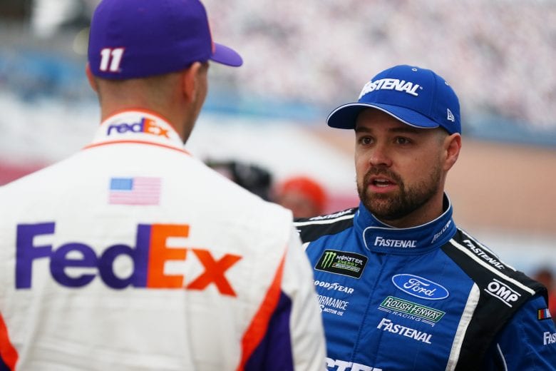 LAS VEGAS, NV - MARCH 01: Ricky Stenhouse Jr., driver of the #17 Fastenal Ford, talks with Denny Hamlin, driver of the #11 FedEx Office Toyota, during qualifying for the Monster Energy NASCAR Cup Series Pennzoil 400 at Las Vegas Motor Speedway on March 1, 2019 in Las Vegas, Nevada.  (Photo by Sarah Crabill/Getty Images) | Getty Images